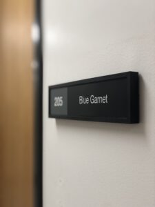 Office Sign outside Blue Garnet office reads 205 Blue Garnet