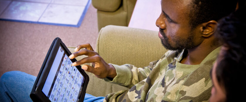 Easterseals participant in Adult Day program accesses a tablet device