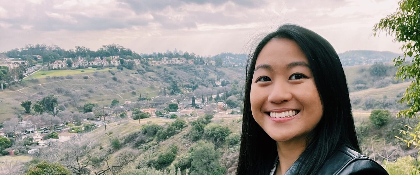 A selfie of a woman on a hike