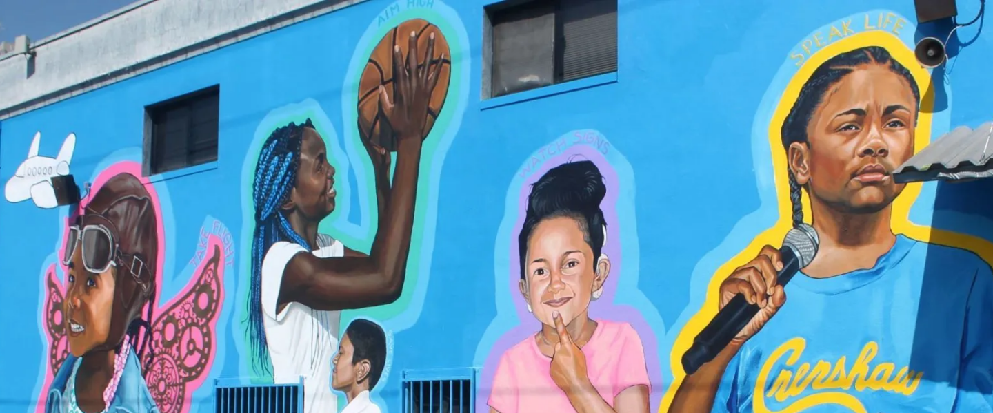 A colorful mural on a bright blue backdrop showcasing children doing various activities: one donning an aviator hat with wings, another gripping a basketball, and a third holding a microphone